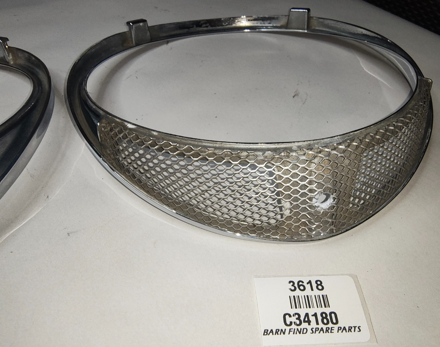 JAGUAR DAIMLER Original pair of METAL Chrome 7" meshed headlamp trim/rims C341806