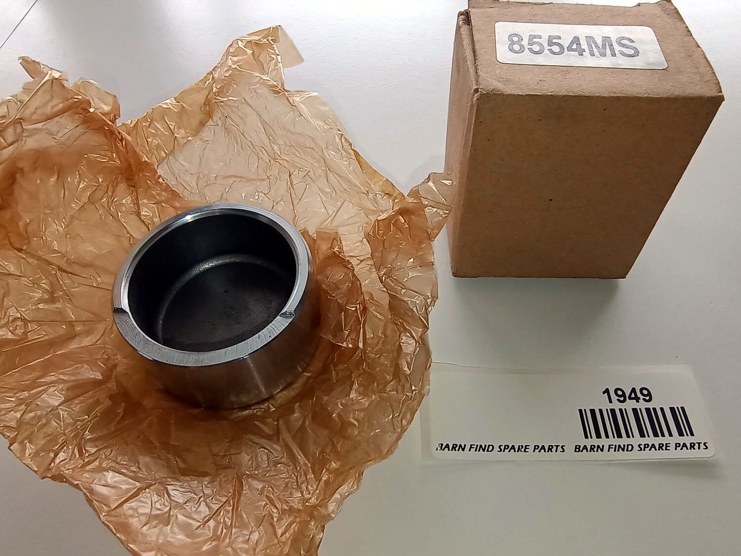 Front Brake Caliper Piston, New Old Stock in original box marked 8554MS 182-800 0