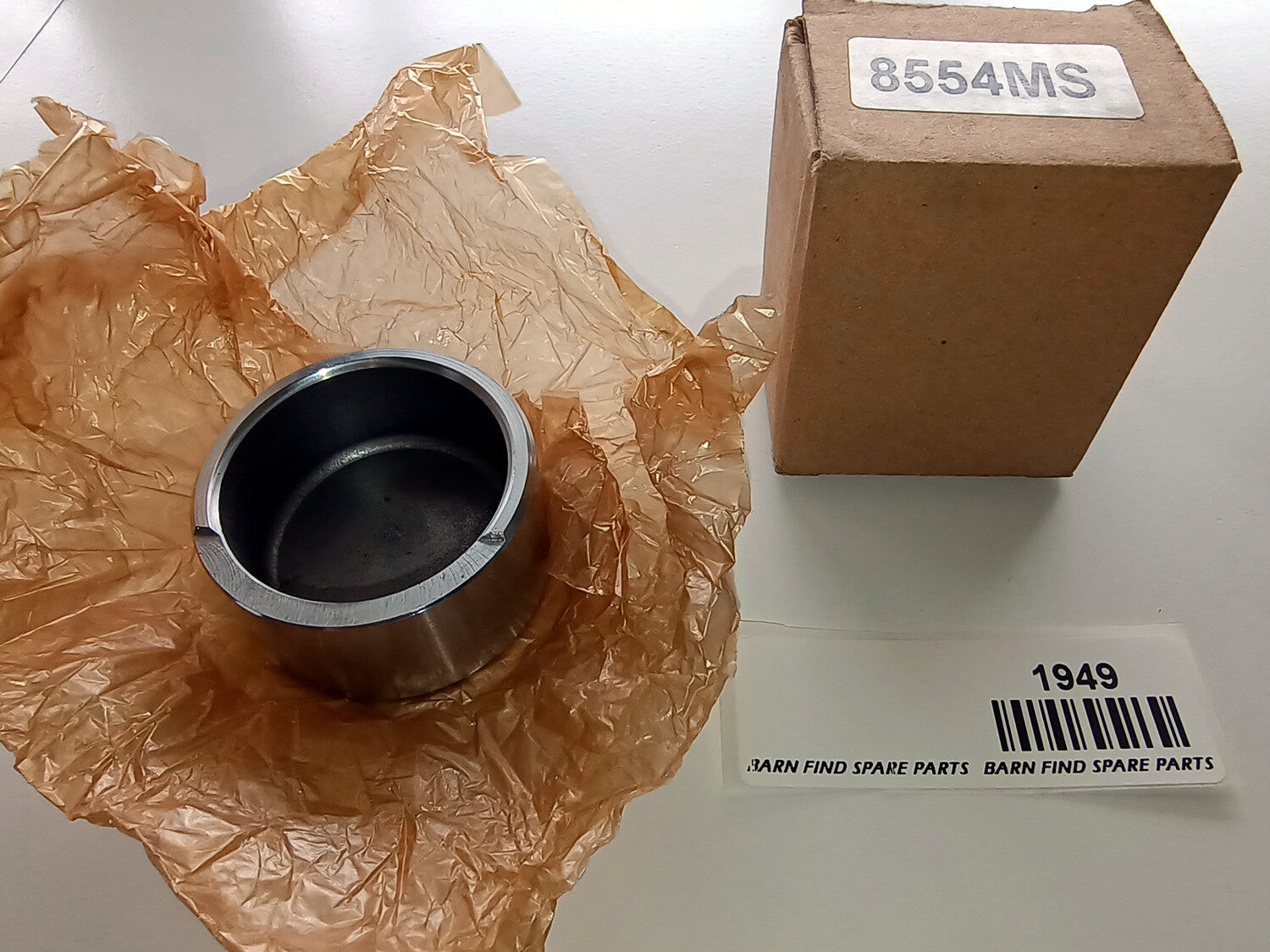 Front Brake Caliper Piston, New Old Stock in original box marked 8554MS 182-800 0