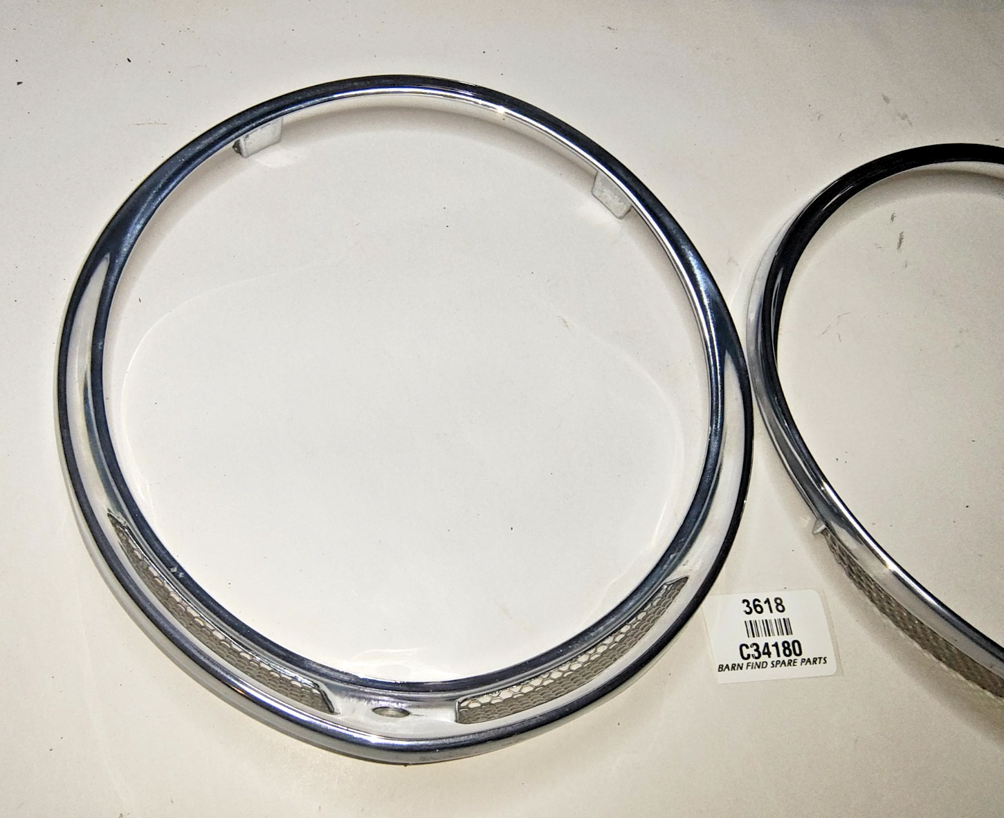 JAGUAR DAIMLER Original pair of METAL Chrome 7" meshed headlamp trim/rims C341802