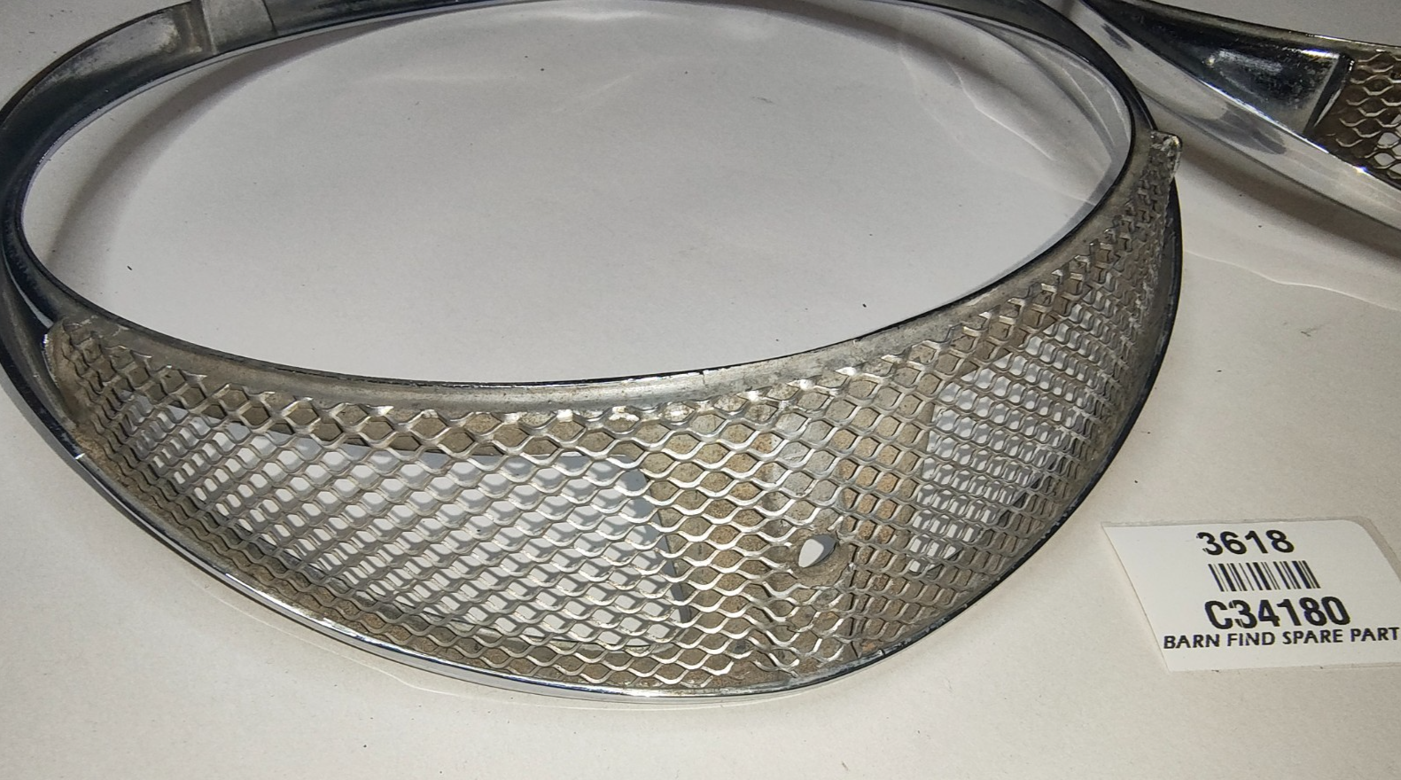 JAGUAR DAIMLER Original pair of METAL Chrome 7" meshed headlamp trim/rims C341805