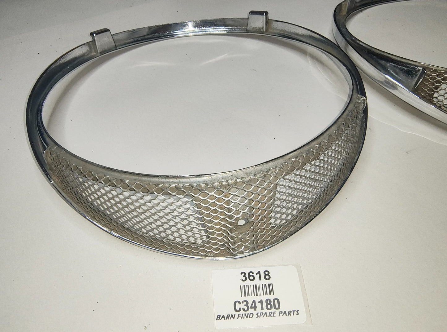 JAGUAR DAIMLER Original pair of METAL Chrome 7" meshed headlamp trim/rims C341804