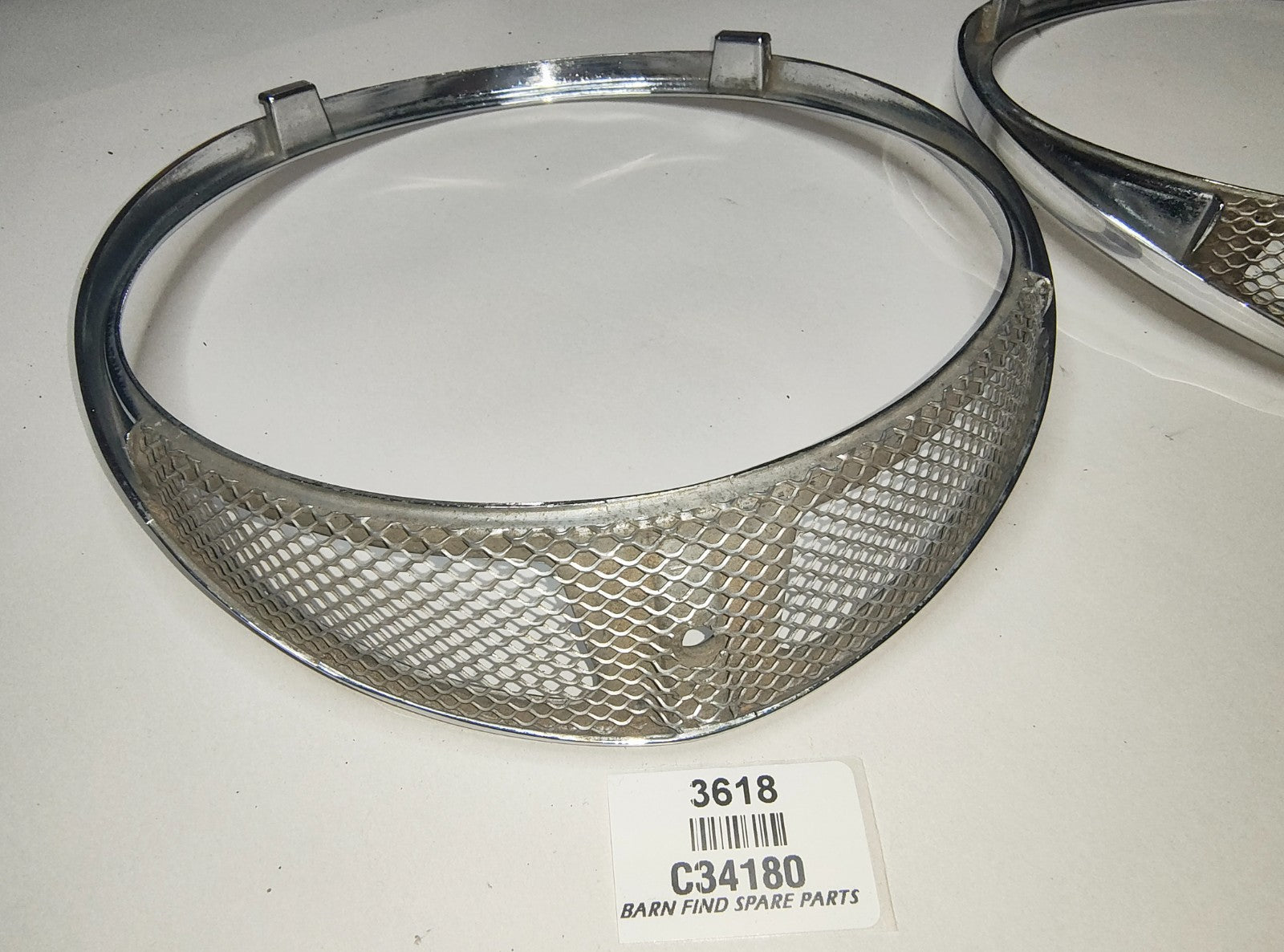 JAGUAR DAIMLER Original pair of METAL Chrome 7" meshed headlamp trim/rims C341804